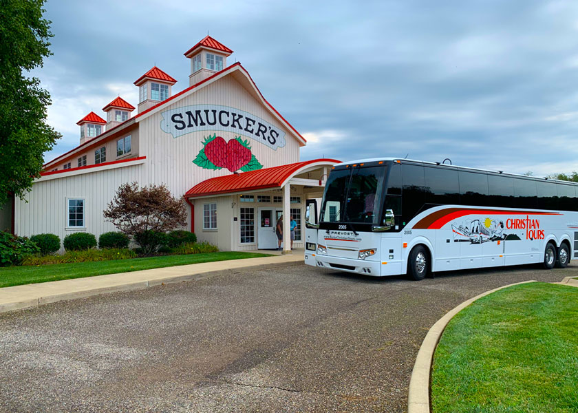 A Christian Tour bus stops at the J.M. Smuckers Store & Cafe in Ohio.